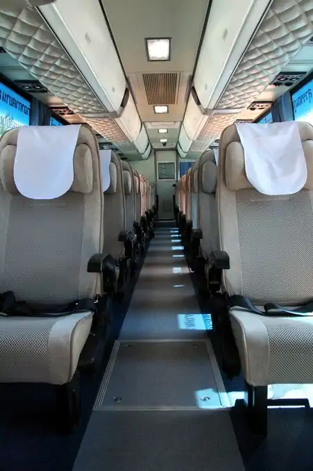 Bus # 392 interior: comfortable chairs, 4 flatscreen TV's, toilet